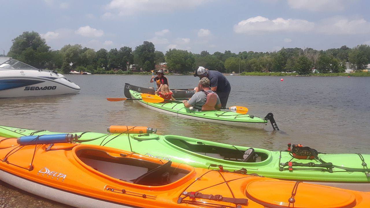 Kayaks and canoes on the water