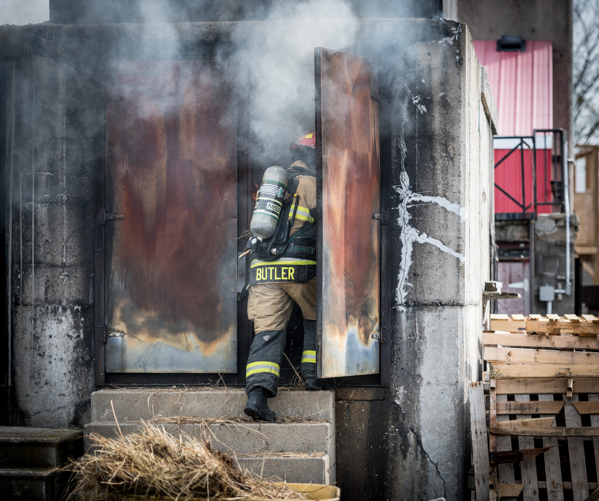firefighter entering burning building