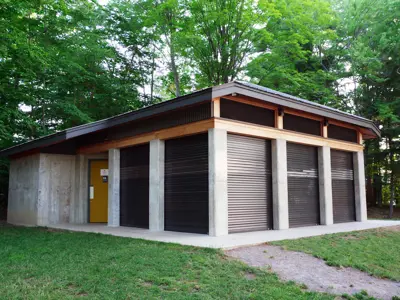 A pavillion with several garage style doors